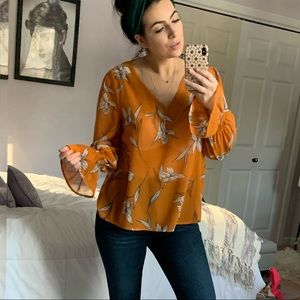 Orange floral blouse